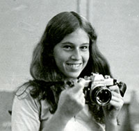 Emily Sper with camera in high school